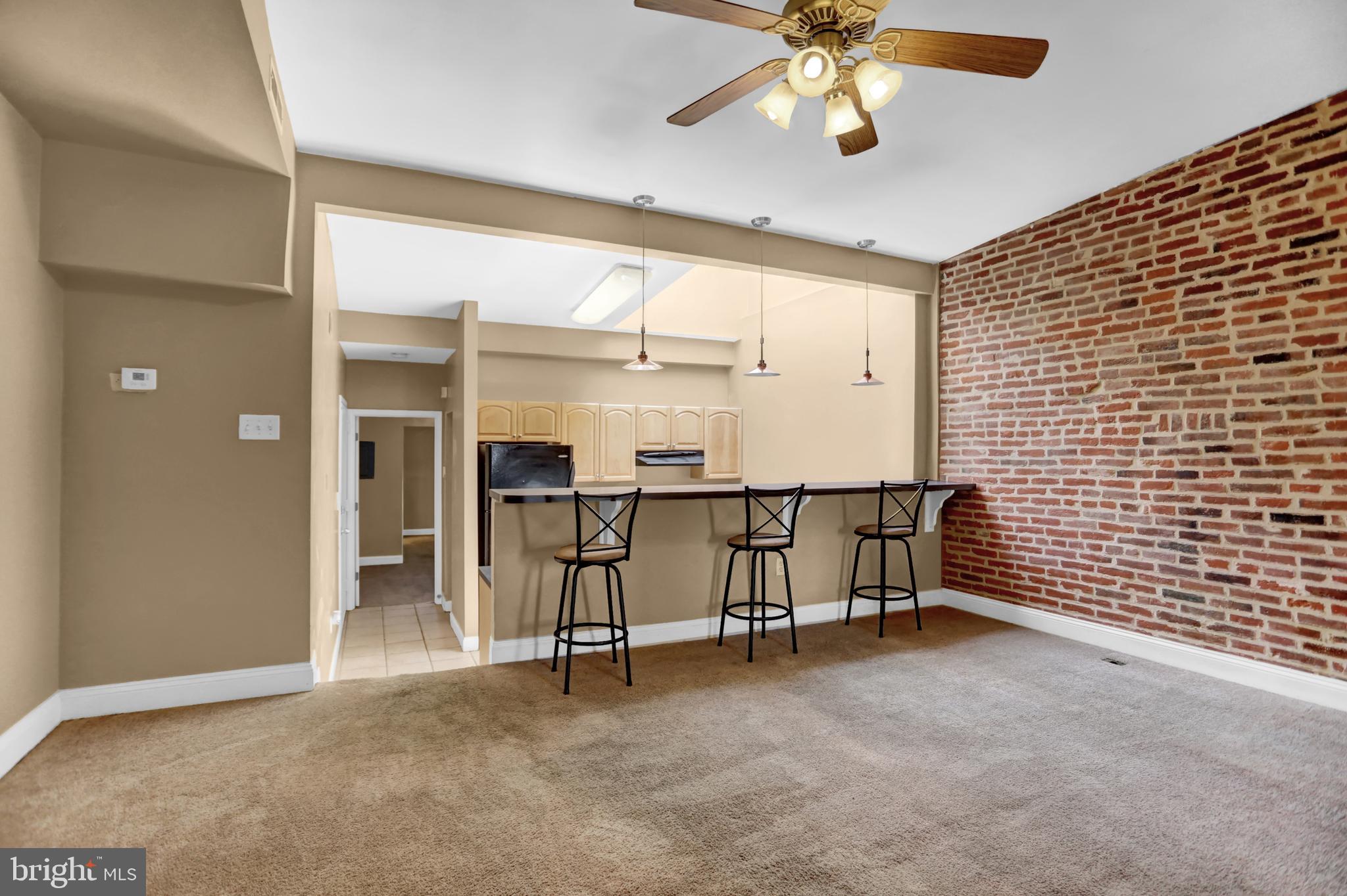 1103 Light Street, Unit B Baltimore, MD 21230 - Photo 10 of 23 a view of an empty room with a ceiling fan