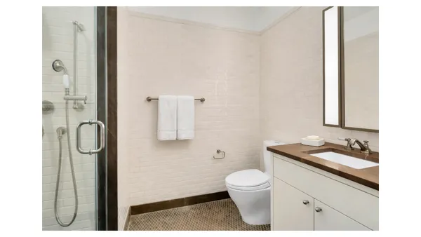 a bathroom with a sink a toilet and tub