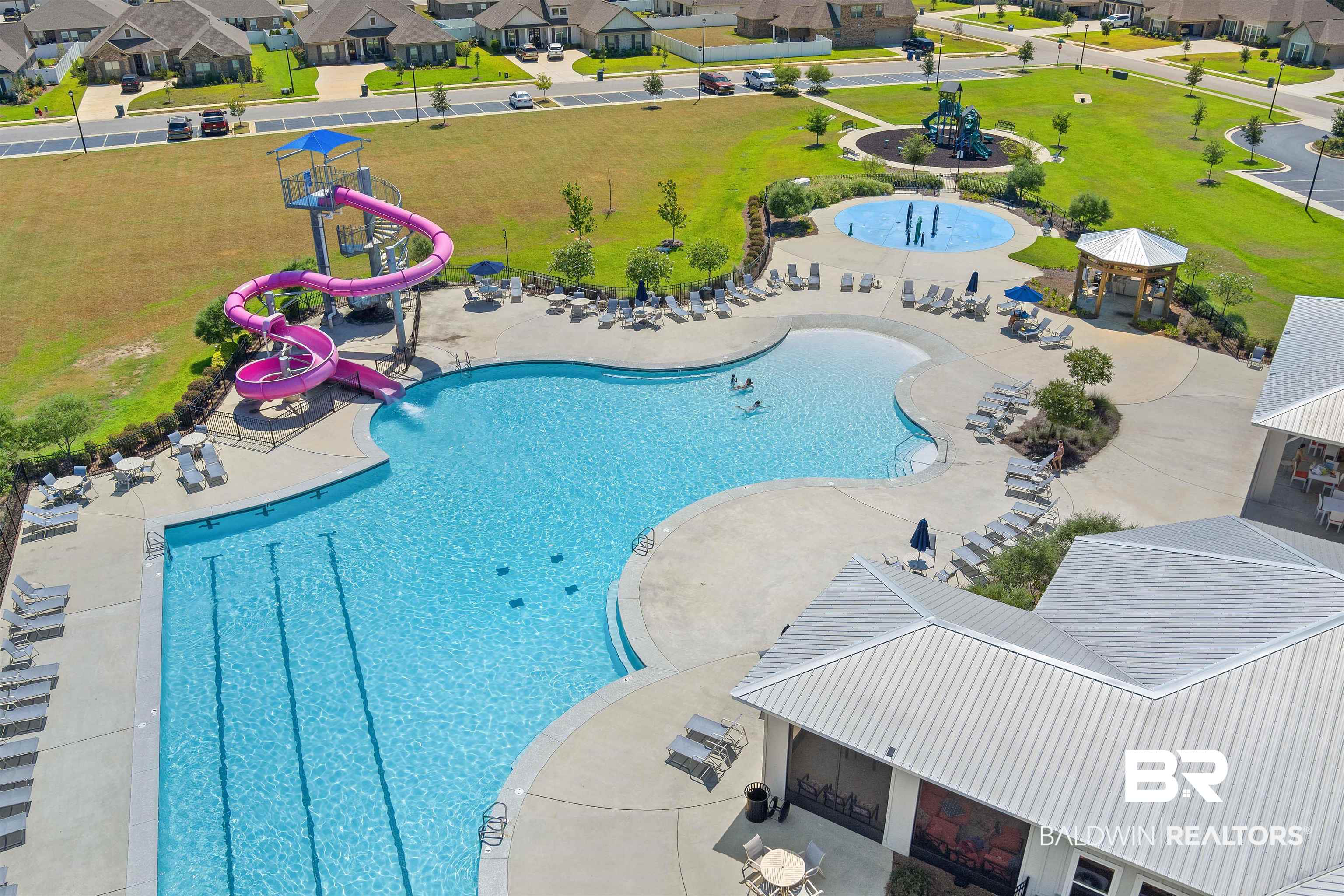 24341 Alydar Loop Daphne, AL 36526 - Photo 42 of 45 Community pool featuring a water slide, a residential view, and a patio