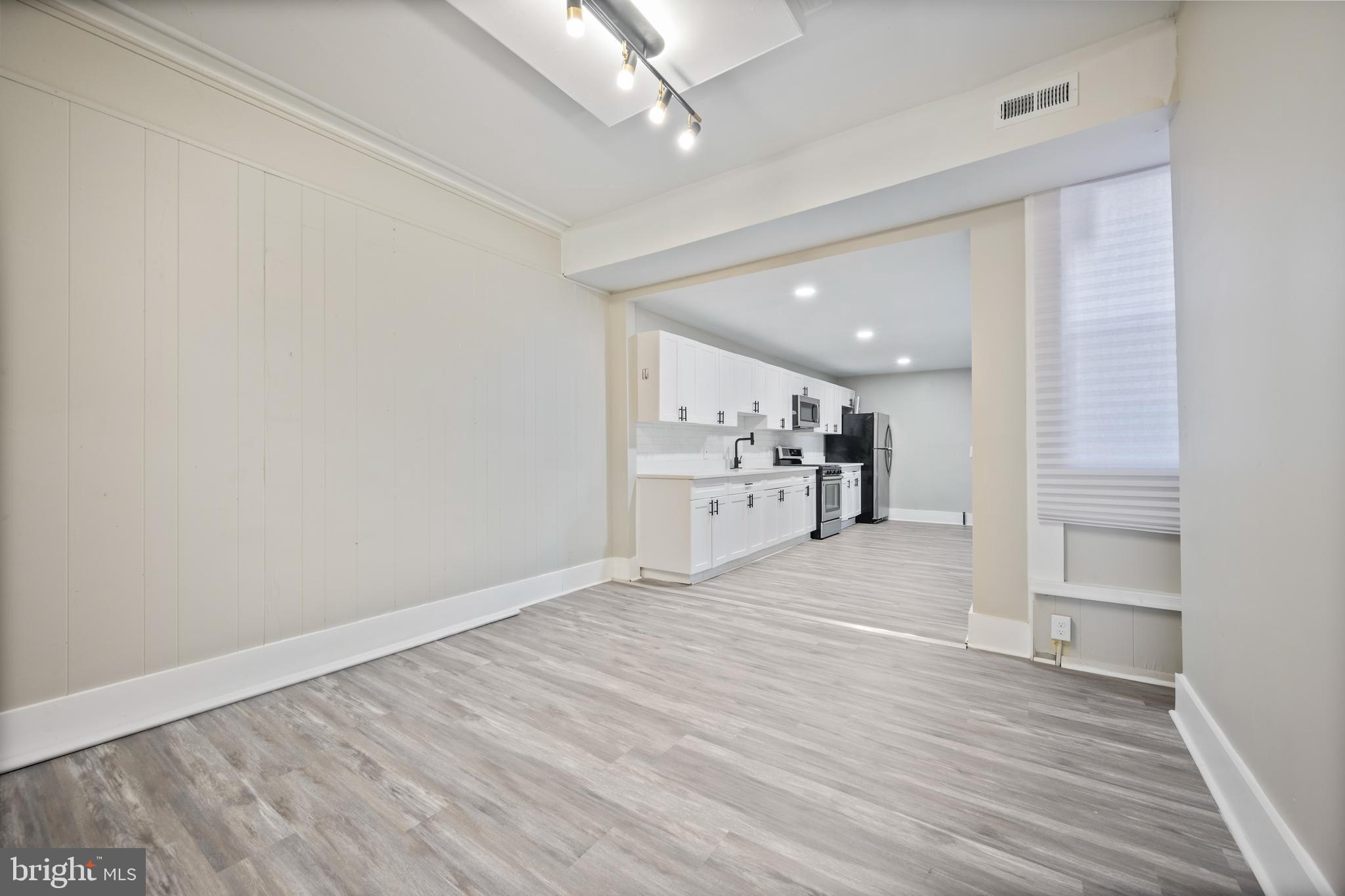1038 Brantley Avenue Baltimore, MD 21217 - Photo 19 of 38 a view of a kitchen with wooden floor and a sink