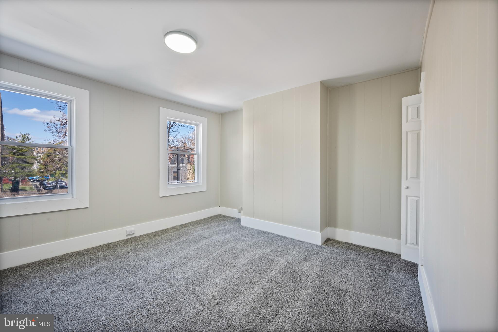 1038 Brantley Avenue Baltimore, MD 21217 - Photo 28 of 38 an empty room with windows and closet
