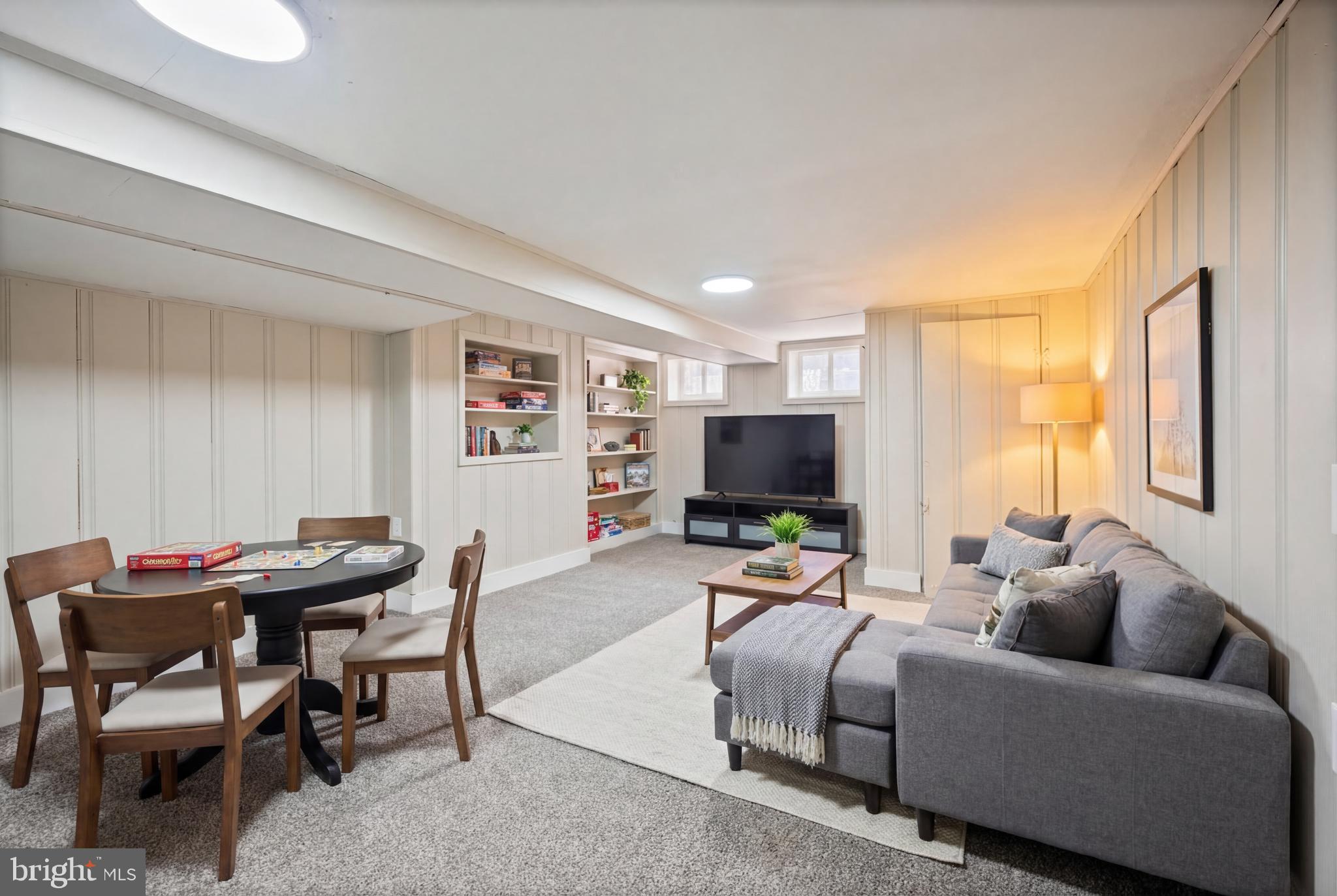 1038 Brantley Avenue Baltimore, MD 21217 - Photo 5 of 38 a living room with furniture and a flat screen tv