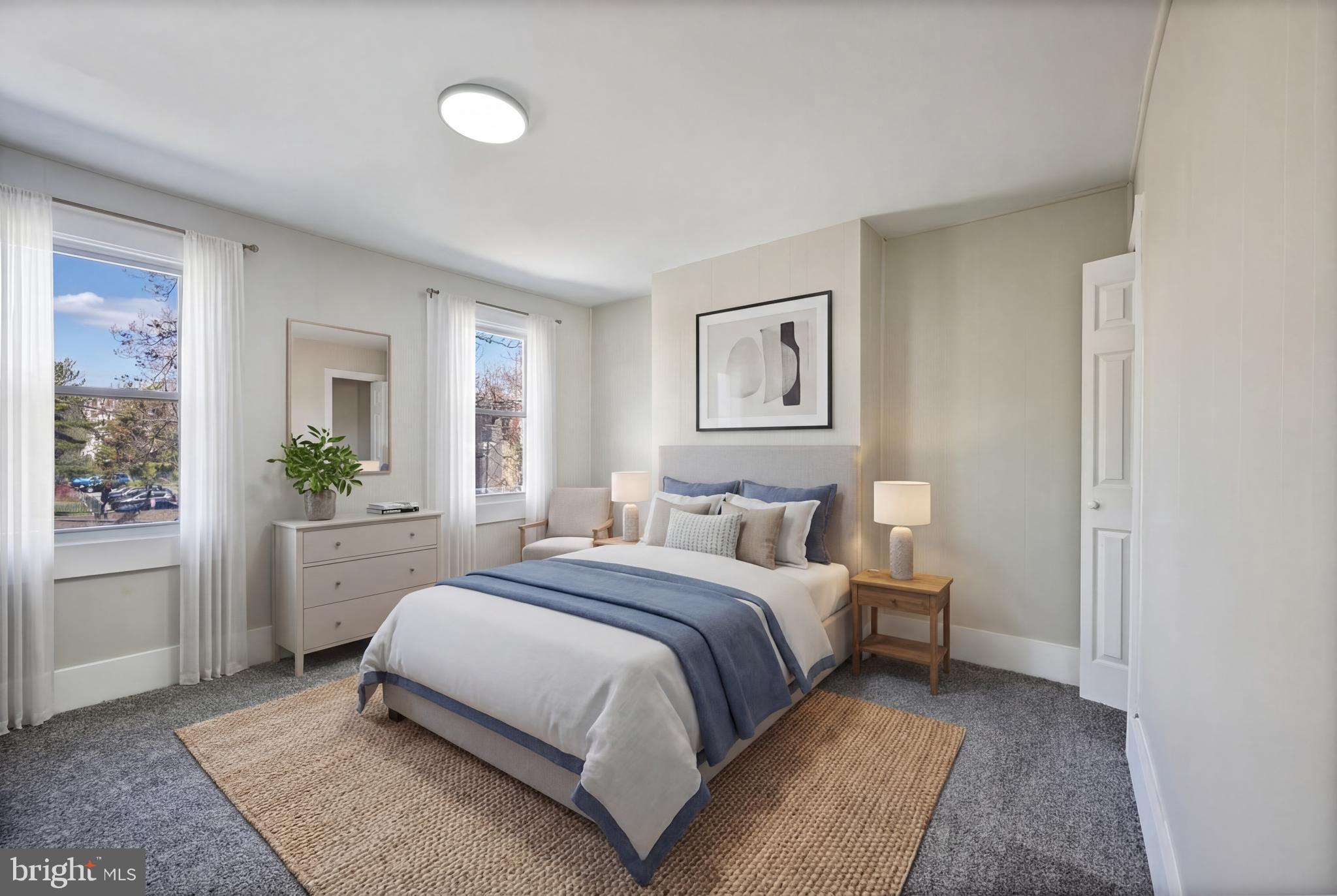 1038 Brantley Avenue Baltimore, MD 21217 - Photo 6 of 38 a bedroom with a bed and a table in it