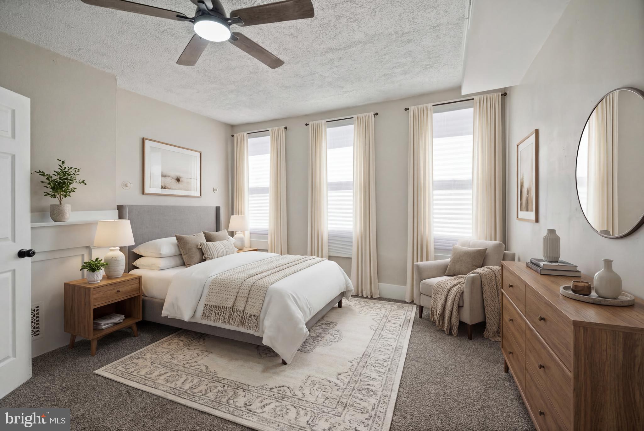 1038 Brantley Avenue Baltimore, MD 21217 - Photo 9 of 38 a bedroom with a bed a window and a chandelier