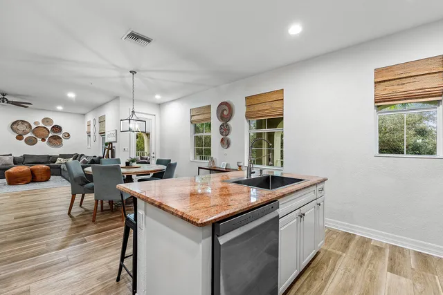 a view of kitchen island with granite countertop lots of counter top space