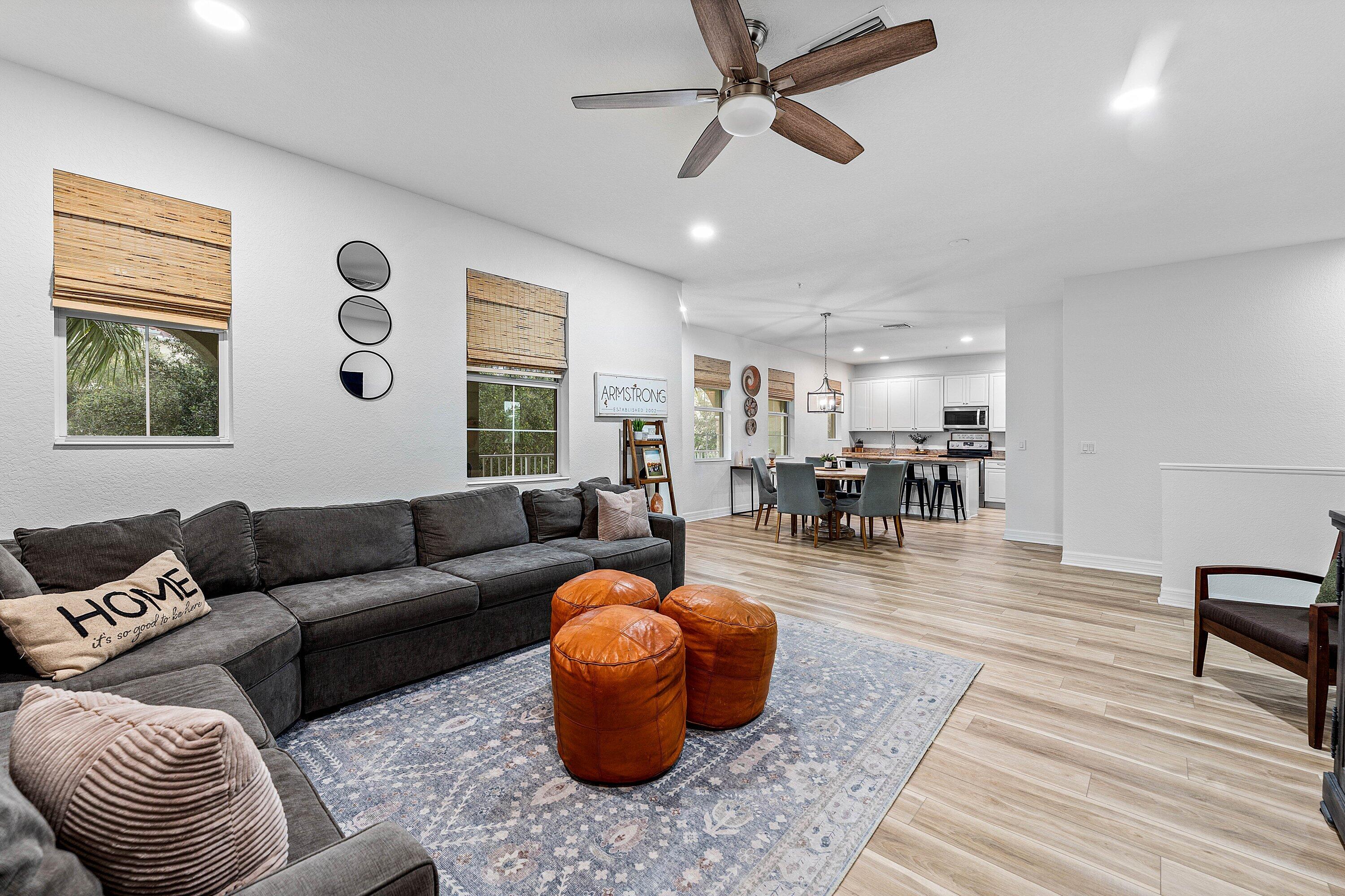 1056 Community Drive Jupiter, FL 33458 - Photo 2 of 50 a living room with furniture and wooden floor