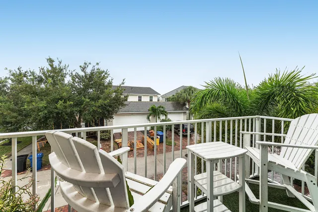 a view of a chairs and table on the deck