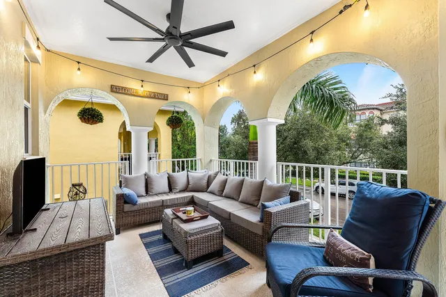 a living room with furniture and a large window