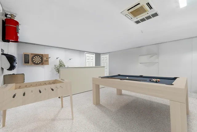 a kitchen with stainless steel appliances kitchen island granite countertop a stove and a refrigerator