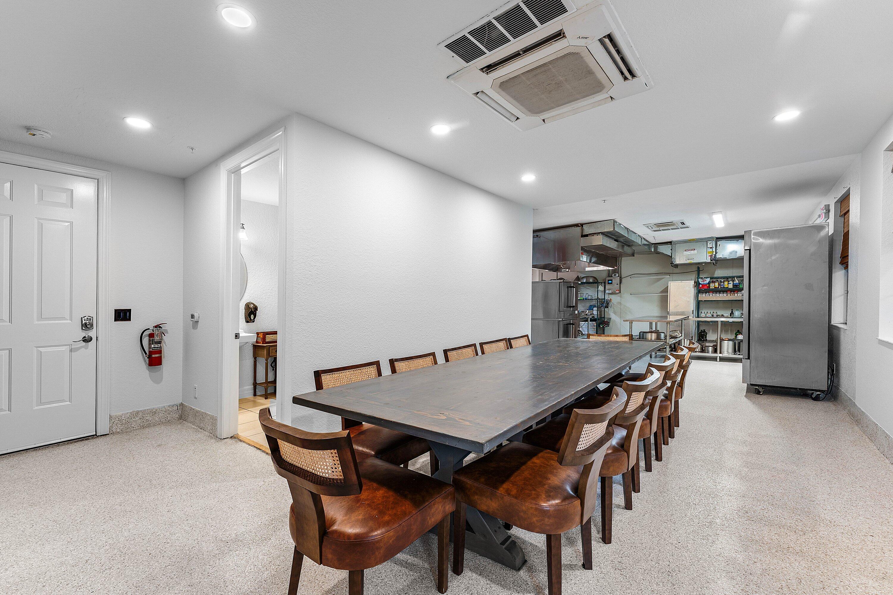 1056 Community Drive Jupiter, FL 33458 - Photo 5 of 50 a view of a dining room with furniture