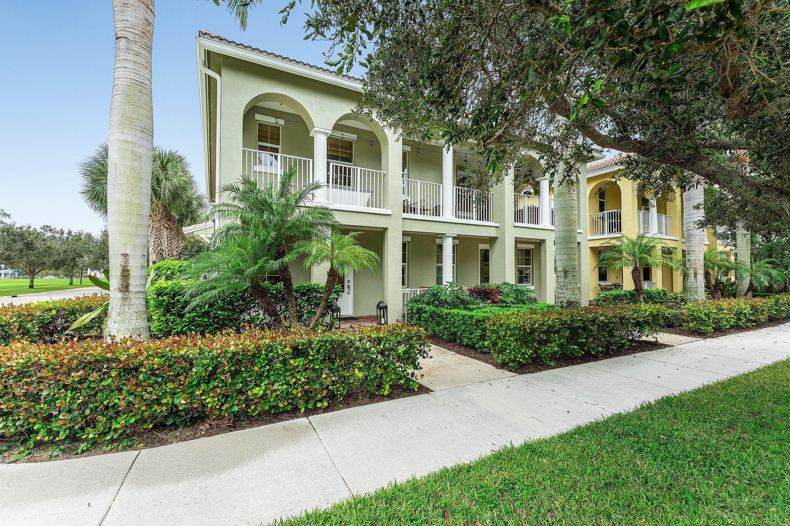 1056 Community Drive Jupiter, FL 33458 - Photo 7 of 50 front view of a house with a yard