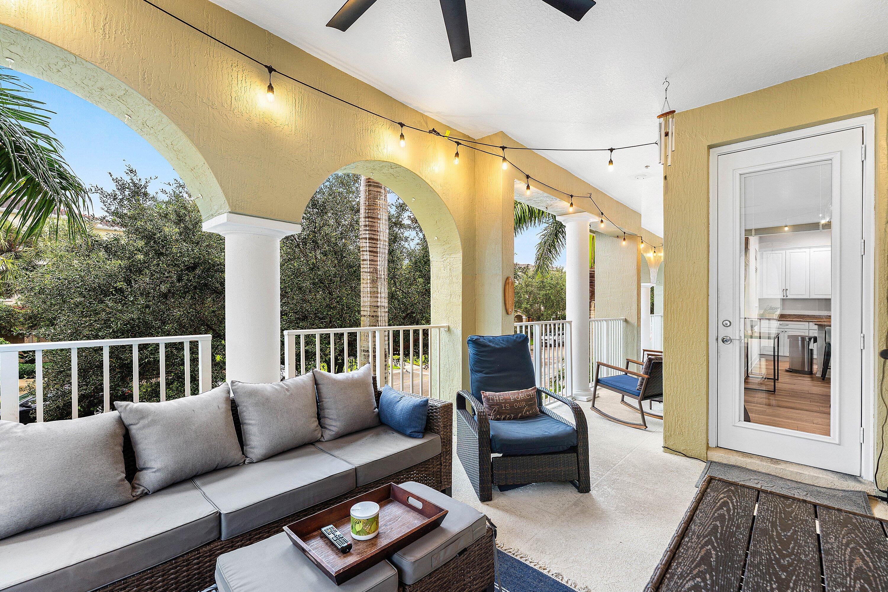 1056 Community Drive Jupiter, FL 33458 - Photo 8 of 50 a living room with furniture and a large window
