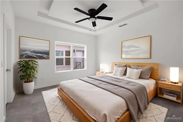 a view of a livingroom with a ceiling fan and window