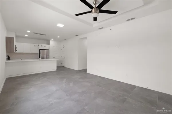 a view of a kitchen with a sink and cabinets