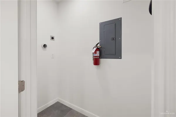a bedroom with a bed and painting on the wall
