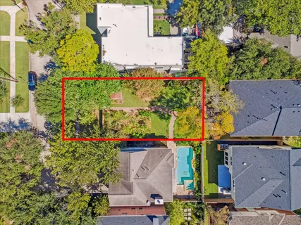 an aerial view of house and swimming pool