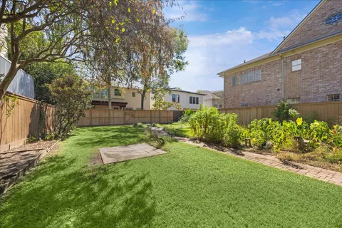 a backyard of a house with lots of green space
