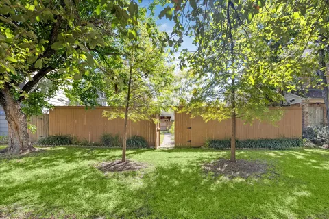 a backyard of a house with lots of green space