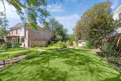 a view of a big yard next to a house