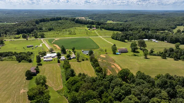 an aerial view of a houses with a lake view