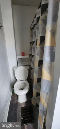 a bathroom with a shower and a mirror