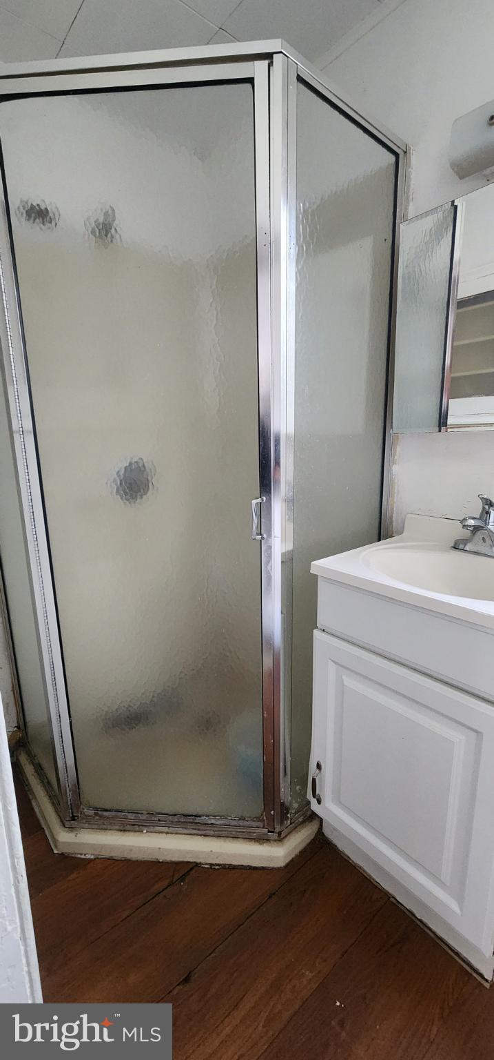 645 North 10th Street Reading, PA 19604 - Photo 23 of 27 a bathroom with a shower and a mirror