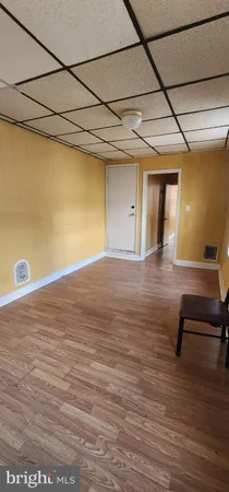 a view of a room with a ceiling fan
