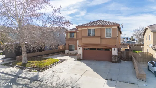 a view of a house with swimming pool and sitting area