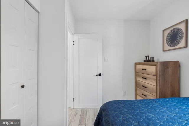 a bedroom with a bed and a cabinets