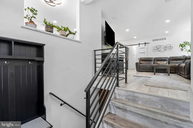 a view of a livingroom with furniture and windows