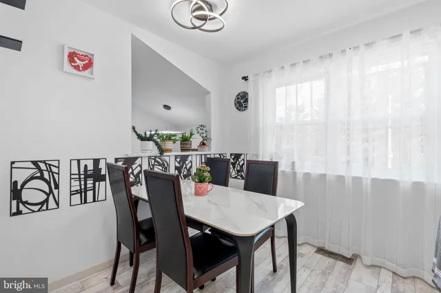 a view of a dining room with furniture and window
