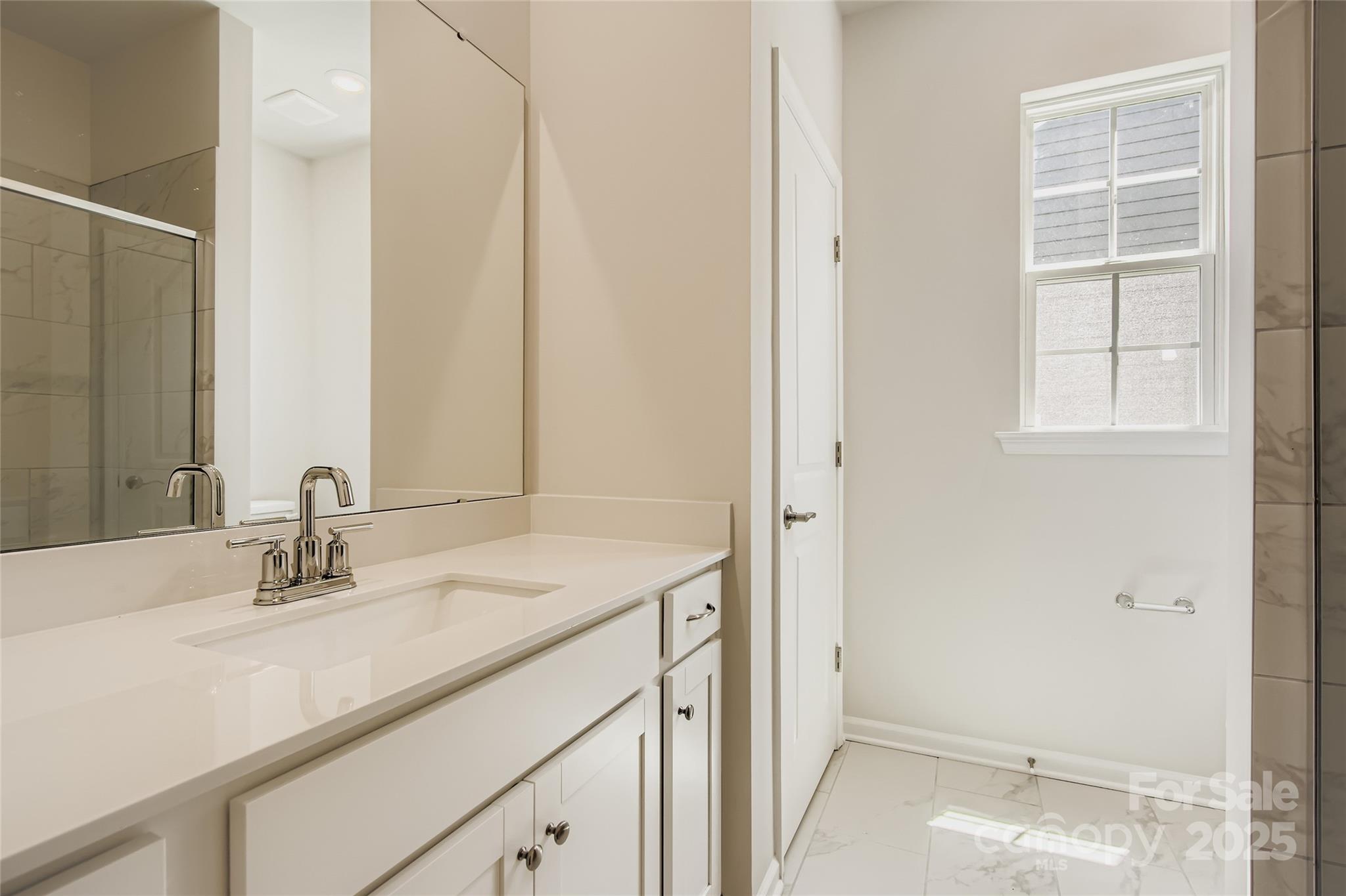 2831 Morning Song Way Lancaster, SC 29720 - Photo 11 of 18 a bathroom with a sink and a mirror