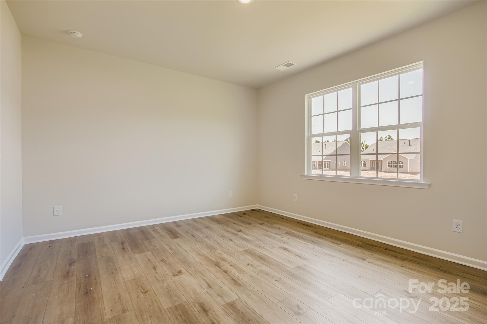 2831 Morning Song Way Lancaster, SC 29720 - Photo 7 of 18 an empty room with a window