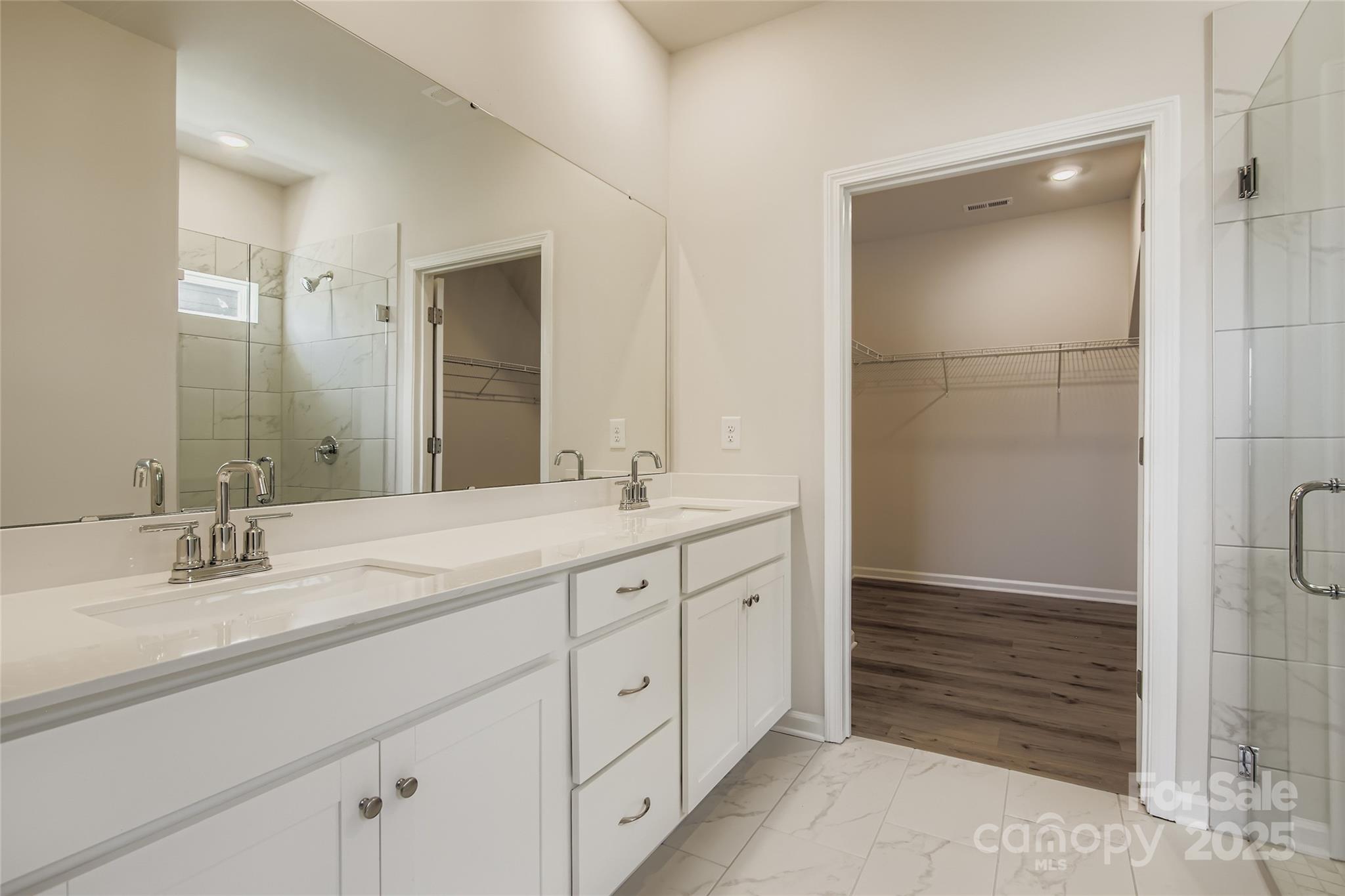 2831 Morning Song Way Lancaster, SC 29720 - Photo 8 of 18 a bathroom with double vanity sink and a mirror