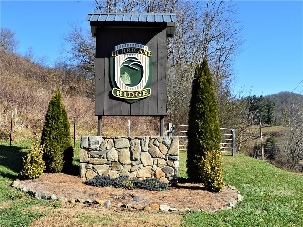 0 Ridge Top Circle Road, Unit 69 70 71 Clyde, NC 28721 - Photo 8 of 9 a view of entrance gate of house and mountain view
