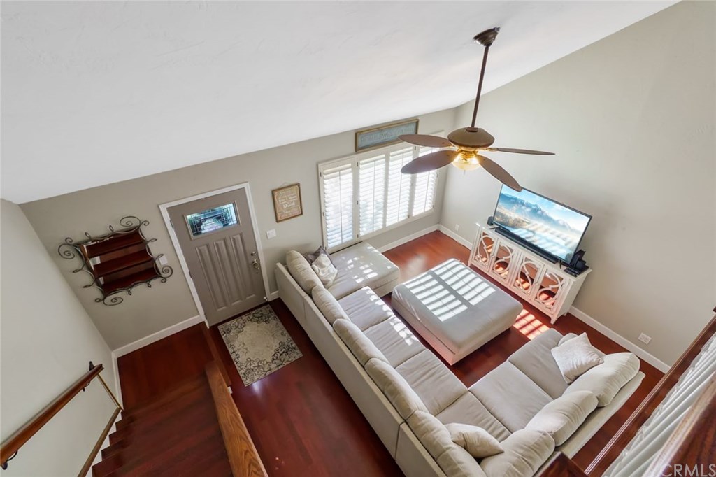 2419 Minuteman Way Costa Mesa, CA 92626 - Photo 3 of 26 a living room with chairs and a wooden floor