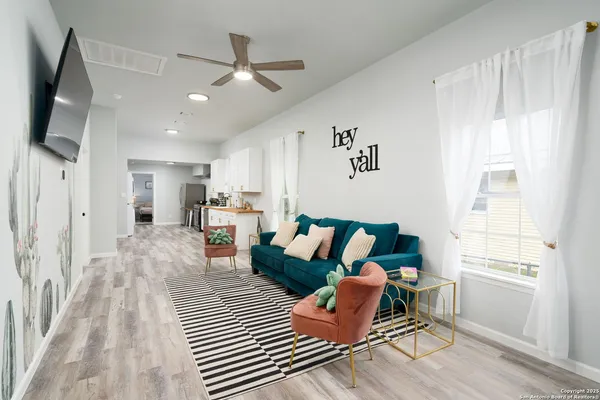 a living room with furniture and a window