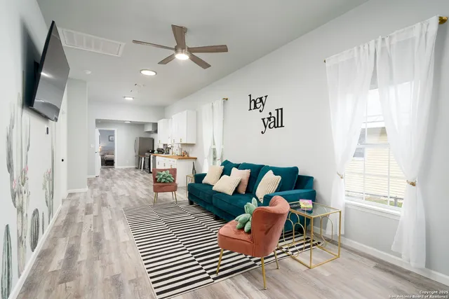 a living room with furniture and a window