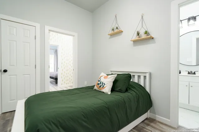 a bedroom with a bed and window