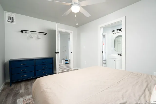 a bedroom with a bed and a dresser