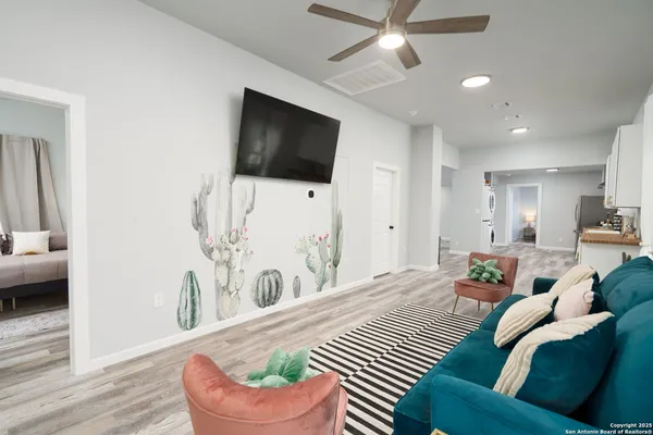 a living room with furniture and a flat screen tv