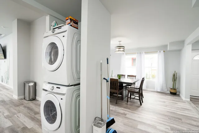 a view of a a dining room with furniture window and wooden floor