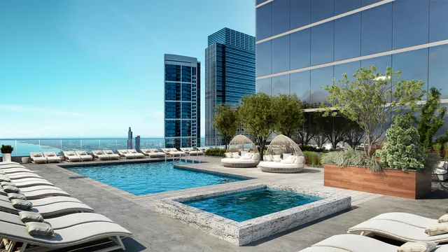 a view of swimming pool with outdoor seating and plants