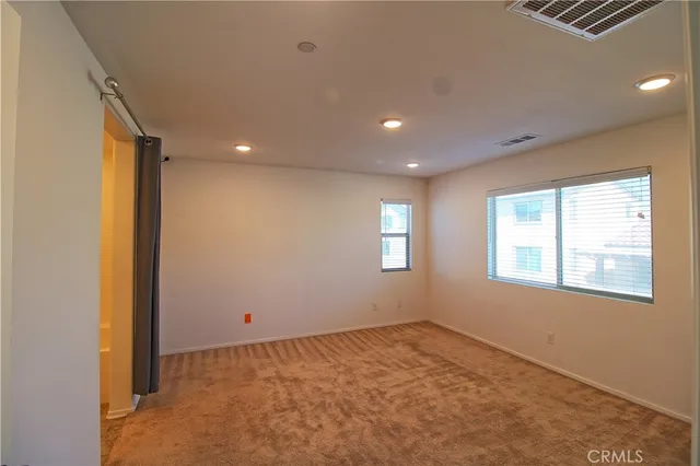 a bathroom with a double vanity sink a mirror and a bathtub