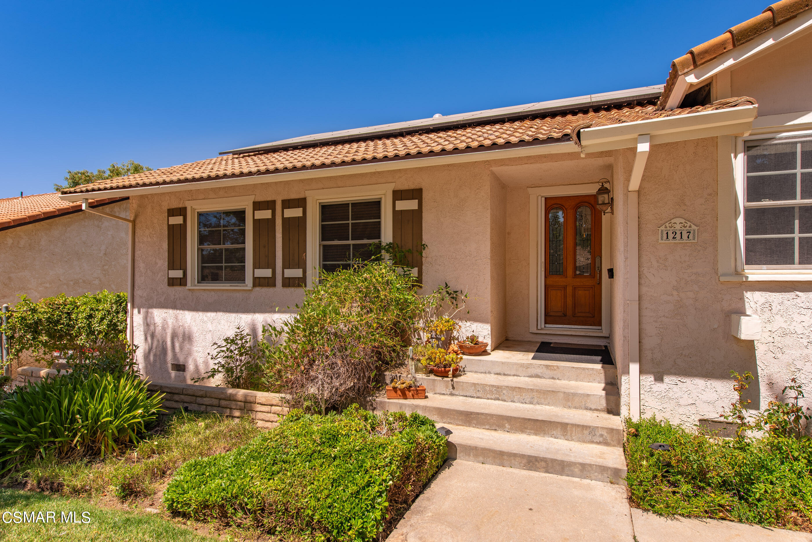 1217 Rambling Road Simi Valley, CA 93065 - Photo 2 of 64 a front view of a house