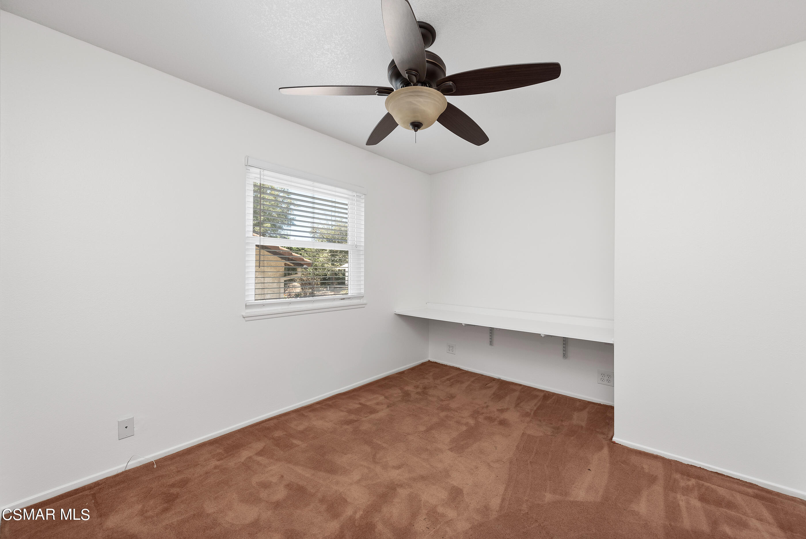 1217 Rambling Road Simi Valley, CA 93065 - Photo 24 of 64 an empty room with a ceiling fan and window
