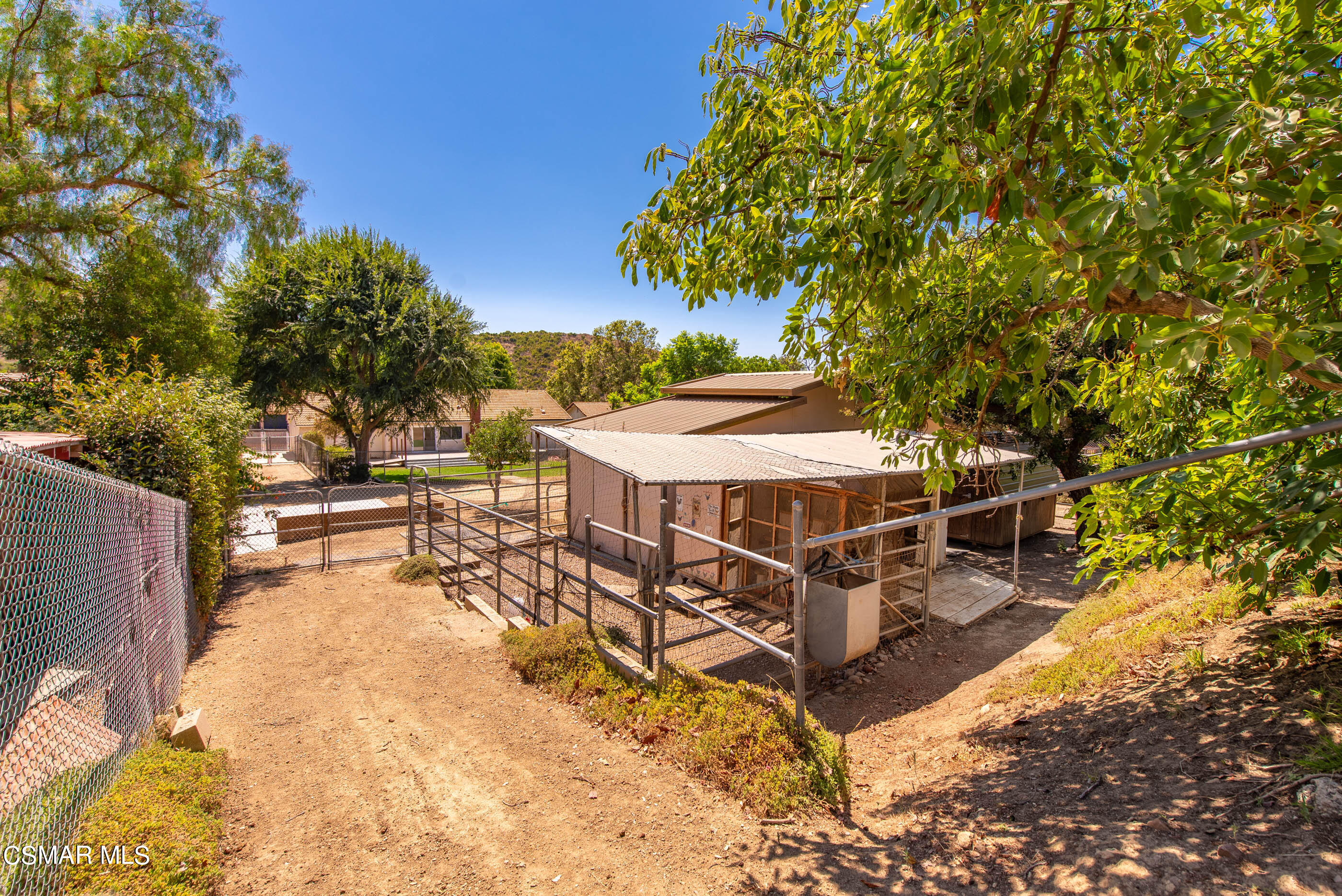 1217 Rambling Road Simi Valley, CA 93065 - Photo 47 of 64 a view of a patio with chairs and a table