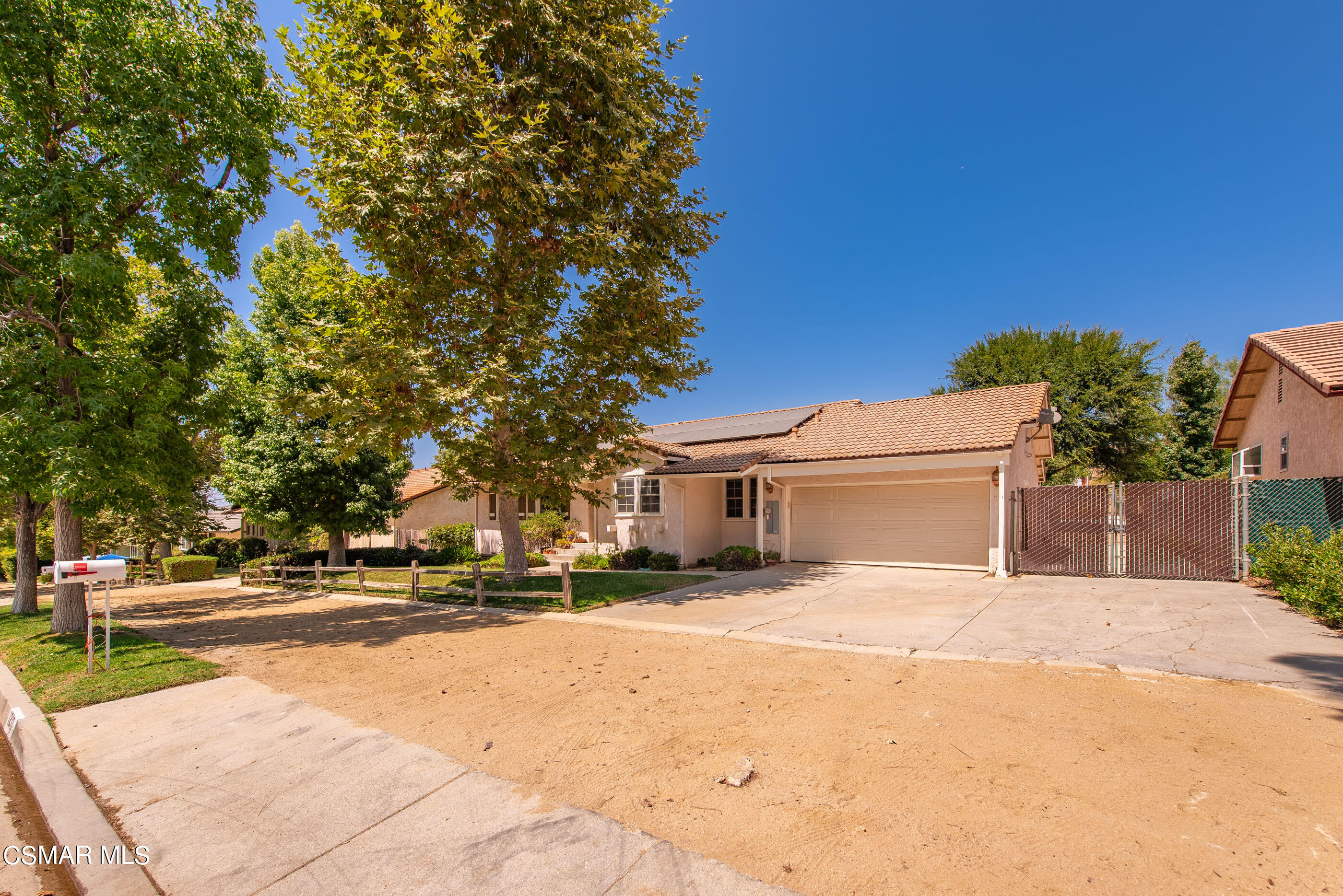 1217 Rambling Road Simi Valley, CA 93065 - Photo 5 of 64 a view of road with yard and car parked
