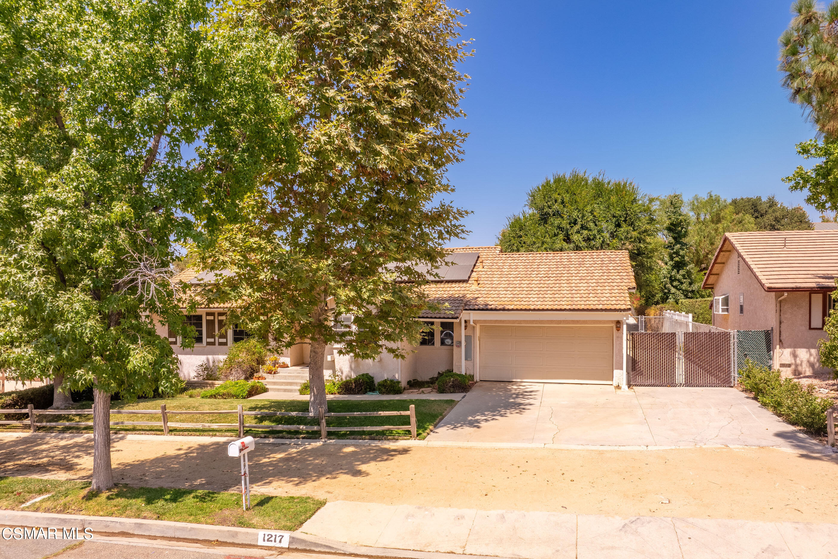 1217 Rambling Road Simi Valley, CA 93065 - Photo 51 of 64 a front view of a house with a garden