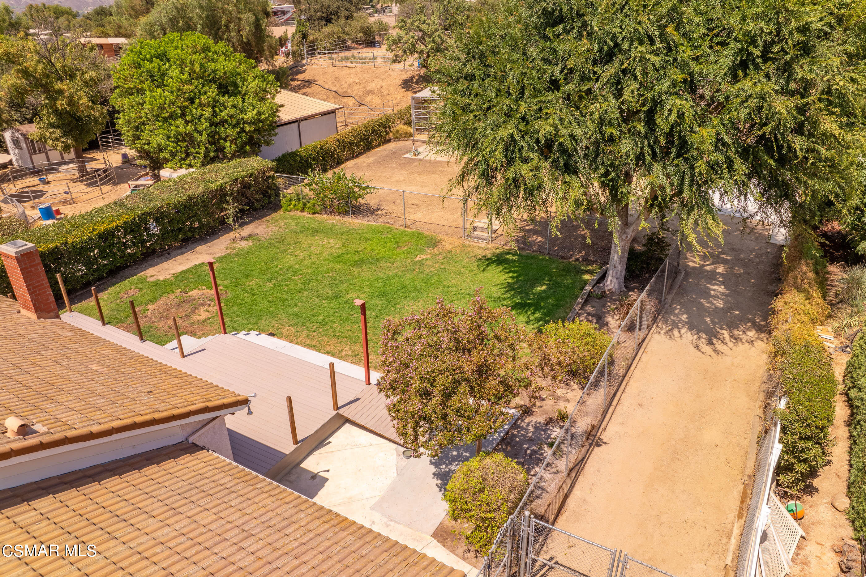 1217 Rambling Road Simi Valley, CA 93065 - Photo 62 of 64 a view of a backyard and floor to ceiling window